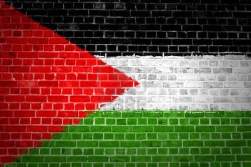 12422706-an-image-of-the-palestine-flag-painted-on-a-brick-wall-in-an-urban-location